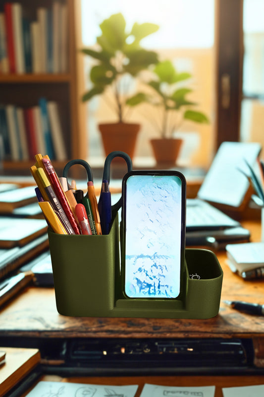 Olive green desk organizer with stationery items on a wooden desk