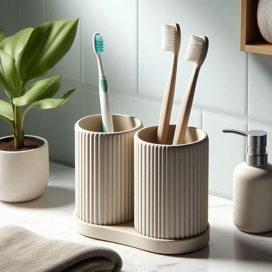 Two toothbrush holders with toothbrushes on a bathroom counter, next to a plant and soap dispenser.